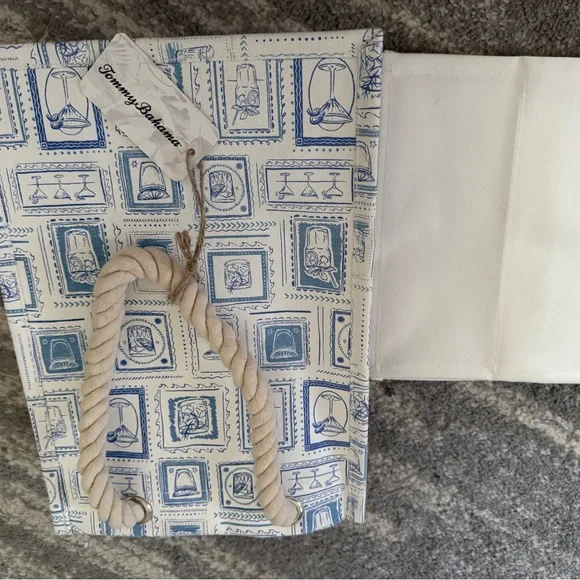 The item is a canvas wine bag by Tommy Bahama, designed to hold four bottles. - Picture 4 of 5